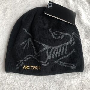 Arc'teryx Black Beanie with Gray and Gold Accents